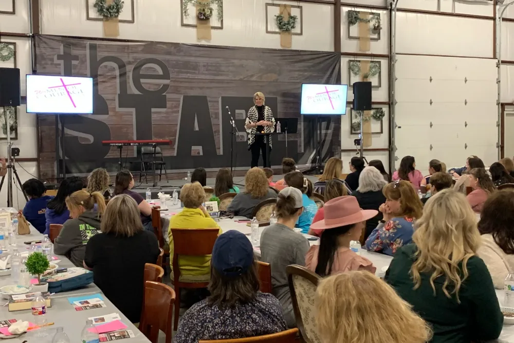 Gayla Grace speaking on stage
